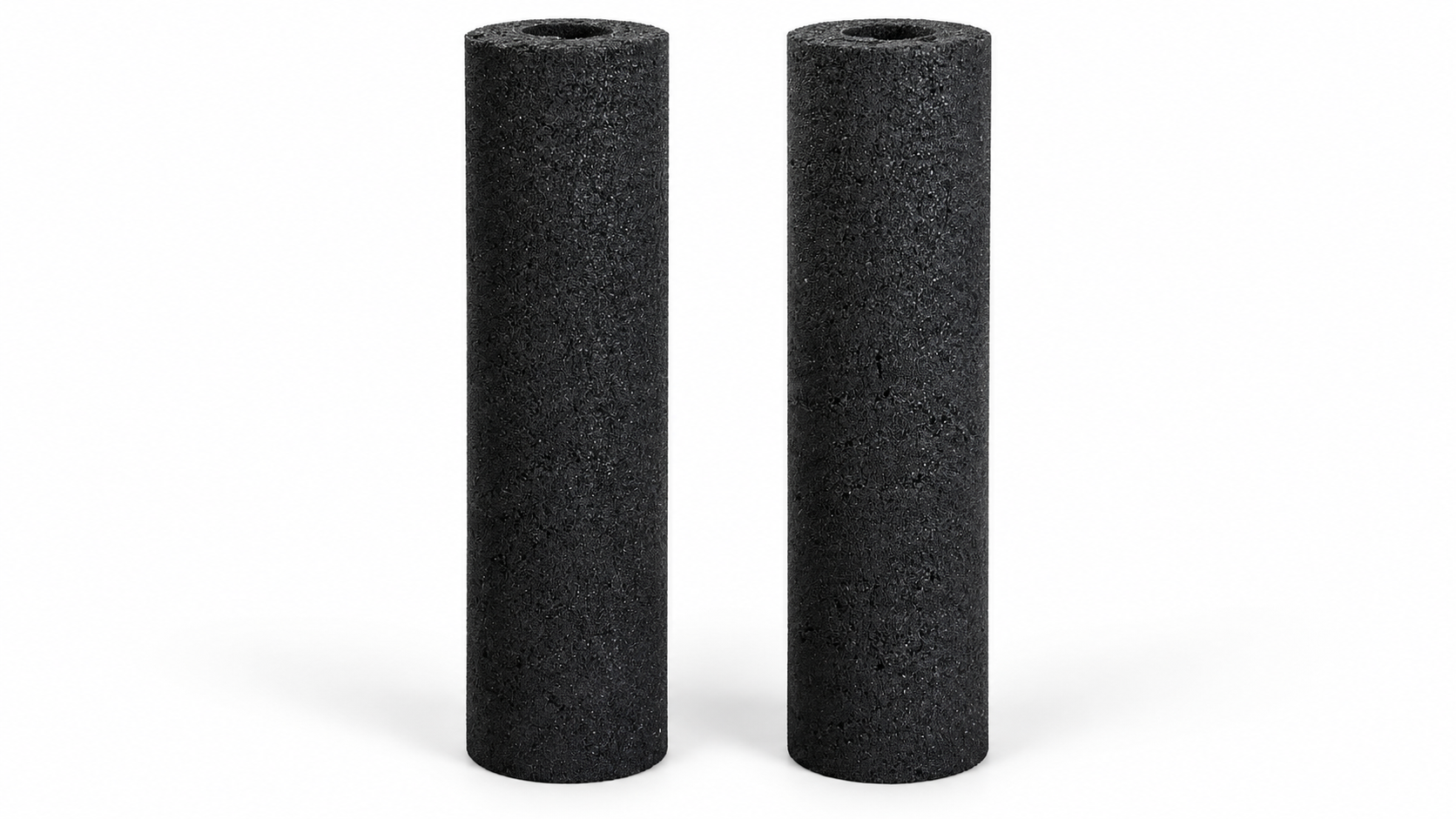 Two black cylindrical carbon filter blocks
